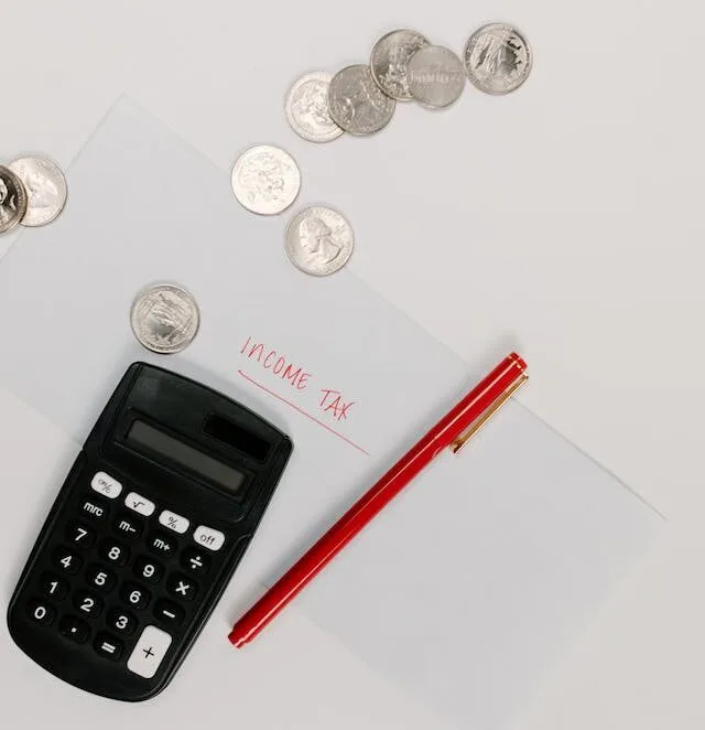 calculator with red pen