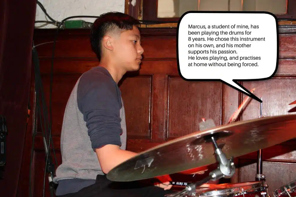 Marcus playing the drums, an instrument he chose